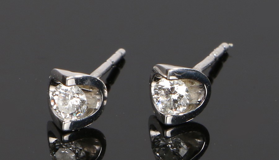 Pair of diamond set ear studs, the round cut diamonds at 0.20 carat each set to 9 carat gold white