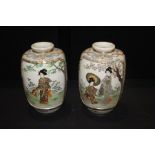 Pair of Japanese vases, with figural decorated panels, 31cm high, (2)