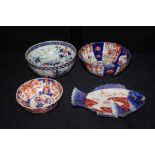 Japanese porcelain, to include three Imari bowls and a dish in the form of a fish, (4)
