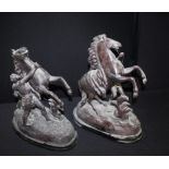 Pair of Spelter Marley Horse tin sculptures after Guillaume Coustou, raised on plinths. 44cm high (