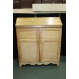 Unusual pine wardrobe, with sloping hinged top above two panelled cupboard doors, the interior