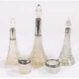 Three glass scent bottles with silver collars, glass salt with silver collar, silver lidded glass