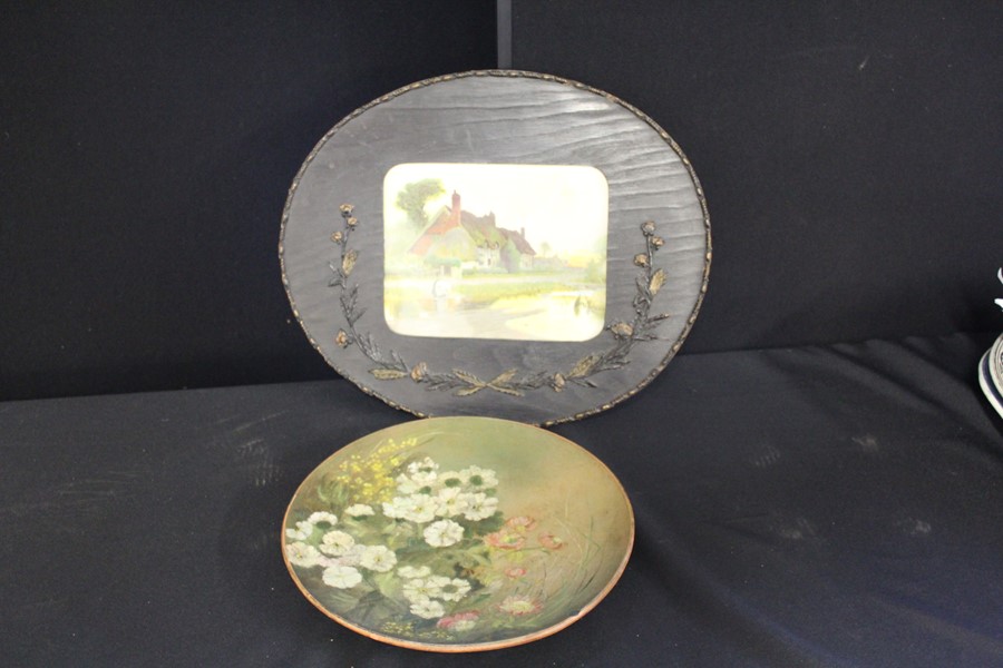 20th century picture depicting a woman collecting water in an oval wooden frame with floral