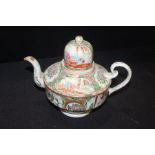 Chinese Canton enamel teapot, with a high cover above the foliate and figural decorated pot, 21cm