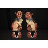 Pair of Chinese temple dogs, 20th Century, 43cm high, (2)