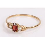 9 carat gold ring, with a central garnet, ring size N