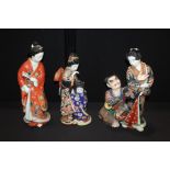 Oriental porcelain figures, to include a Japanese figural scene, 43cm high, a mother and child and a