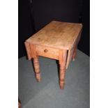 Pine drop leaf table, with frieze drawer, raised on turned legs, 87.5cm wide