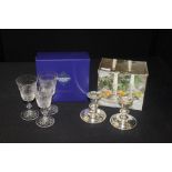 Three Edinburgh Crystal wine glasses, two glass candlesticks (5)