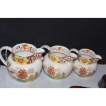 Graduated set of three Midwinter Yang pattern jugs (3)