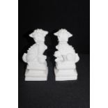 Two carved alabaster temple dogs, 16.5cm, (2)