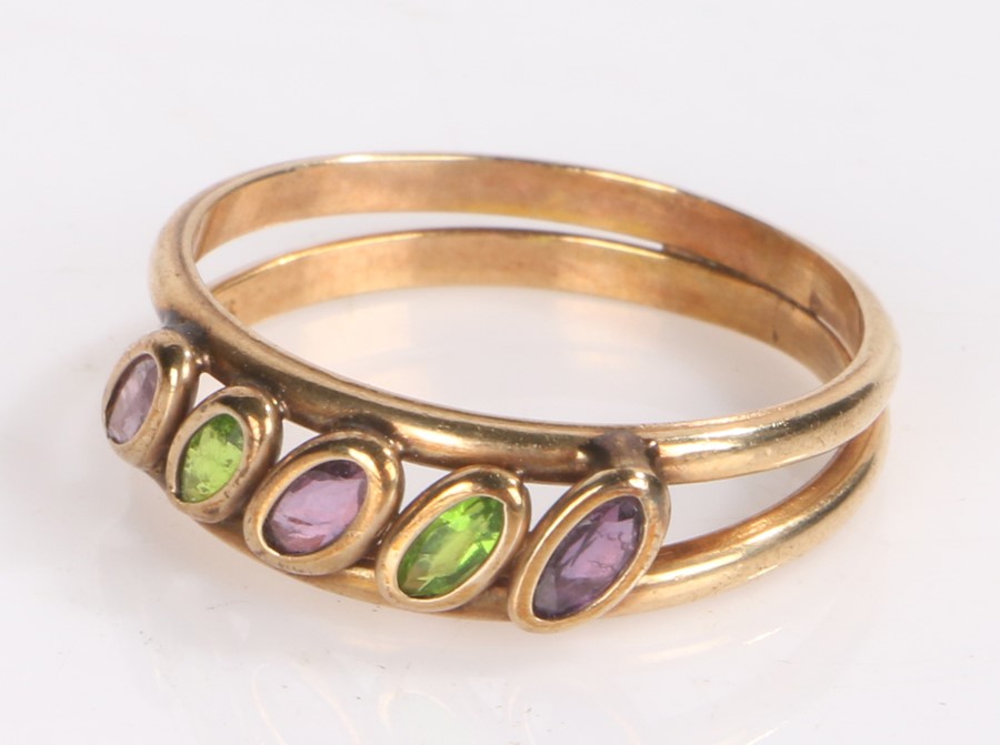 9 carat gold ring the two bands with diagonal set with three amethyst and two emeralds ring size O