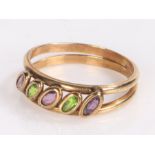 9 carat gold ring the two bands with diagonal set with three amethyst and two emeralds ring size O