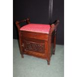 Edwardian piano stool, the upholstered hinged seat with interior compartment and flanked by turned