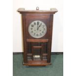 Oak cased wall clock, with a silvered dial and Arabic minutes