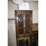 Oak corner cabinet, with astragal glazed doors and cupboard below, together with three lamps and a