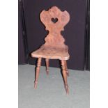 Anglo-Indian hardwood hall chair, with pierced carved back, and serpentine front seat, raised on