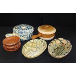 Collection of earthenware, to include two sauce pots and covers, two oval dishes, eight side