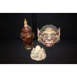 Indonesian mask, together with a Japanese figure and a lidded vase, (3)