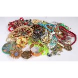 Quantity of costume jewellery , the jewellery to include necklaces, brooches bangles etc contained