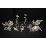 Set of four cockerel table ornaments, together with a pair of snake candlesticks and a smaller
