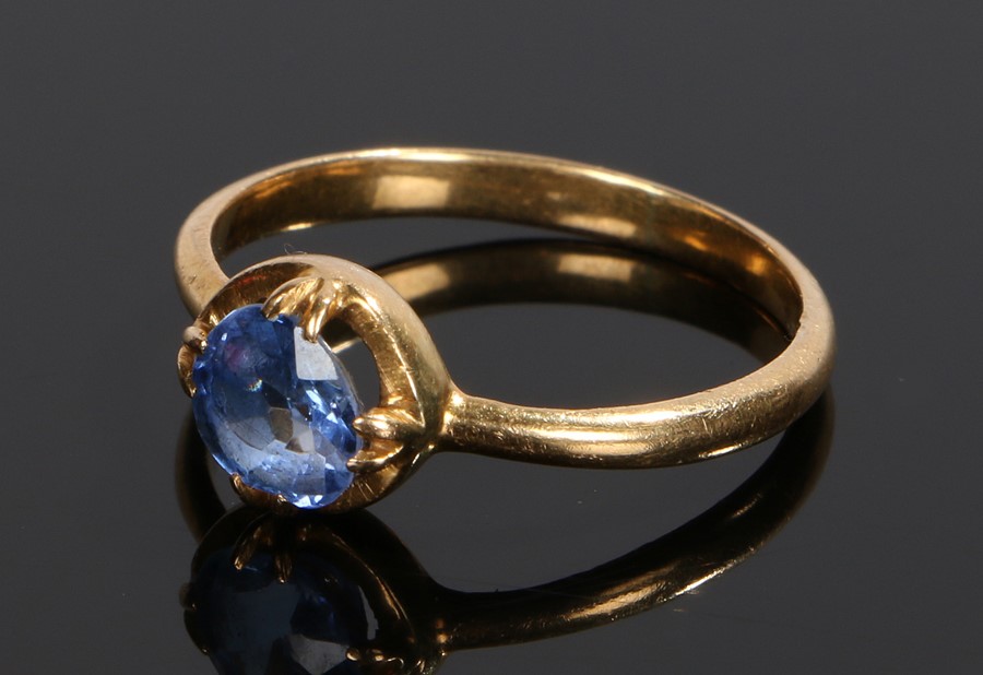 Sapphire set ring, the circular sapphire with a four claw mount and yellow metal shank, ring size S