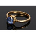 Sapphire set ring, the circular sapphire with a four claw mount and yellow metal shank, ring size S