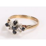 9 carat gold ring with raised shoulders the head set with five sapphires and four diamonds.ring