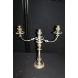 Silver plated candelabra, with lappet leaf effect candle holder above a vase stem and wide base,