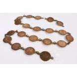 Brass chain set with twenty pennies dating from 1897-1930, 116cm long