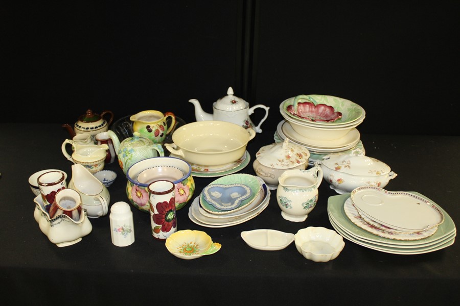 Assorted porcelain services, to include plates, saucers, mugs and bowls.