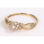 9 carat gold diamond ring with fold over shoulders and diamond set head ring size K