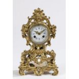 French ormolu mantle clock, with acanthus leaf, shell and foliate cast case, the white enamel dial