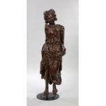 Late 17th/early 18th Century carved oak figure, of large proportions, with curled hair above flowing