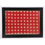 19th Century quilt section, in red and cream panels, framed, 58cm wide