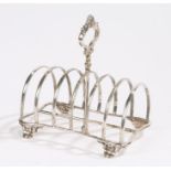 Victorian silver toast rack, with pierced acanthus leaf and scroll, arched divisions for six slices,