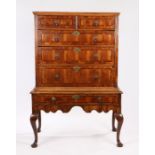George II walnut chest on stand, the rectangular top above two short and three long drawers above