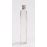 Clear glass scent bottle, the white metal screw cap above a clear glass body with canted corners,