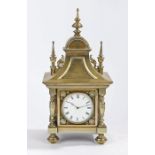 19th Century brass mantel clock, the case with shaped finials above an arched frieze and down