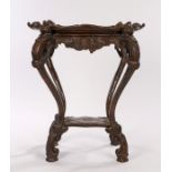 Victorian beech tray table, the removable tray top with shell scroll handles held by carved mask