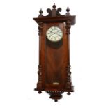 Vienna regulator wall clock, the mahogany veneered case with shaped pediment, arched glazed door and