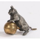 Late 19th Century novelty sewing tape measure, with a white metal cat above the gilt ball