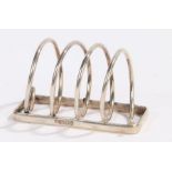 Edward VII silver toast rack, London 1901, makers Hukin and Heath, the four divisions formed from