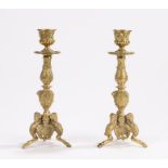 Pair of 19th Century gilt brass candlesticks, with mask and swag cast sconces, acanthus leaf and
