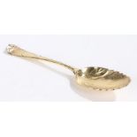 Georgian low mark silver gilt tablespoon, marks rubbed, the leaf form bowl with foliate and scroll