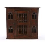 Oak hanging wall cabinet, with gothic pierced arches and spindle turned door, 72cm wide