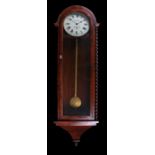 19th Century mahogany wall clock the arched glazed door flanked by barley twist pilasters, the white