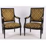 Pair of Regency style ebonised elbow chairs, with gold foliate upholstered backs, seat and arms,