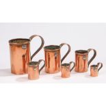 19th Century copper graduated set of measures, with arched handles and cylinder bodies, 4cm up to