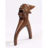 Black forest novelty wooden nut crackers, carved as a gentleman wearing a pointed hat, 16.5cm long